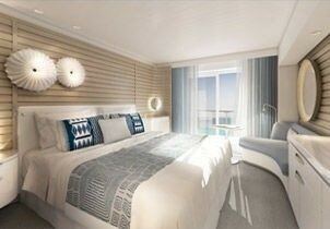 Helle Balkonkabine mit Doppelbett und Zugang zum privaten Balkon mit Meerblick