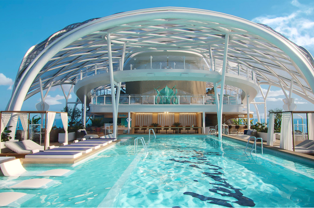 Großzügiger Pool unter filigranem Glaspavillon mit Wasserliegen, Cabanas und Bar im Hintergrund.