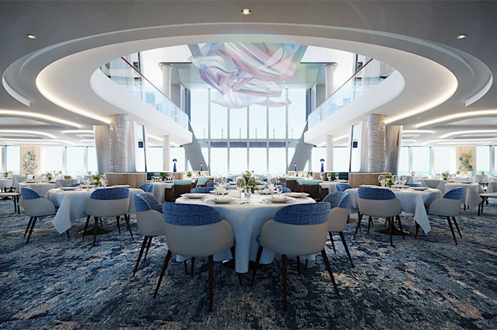 Hauptrestaurant Atlantik mit runden, blau gedeckten Tischen und skulpturaler Deckengestaltung.