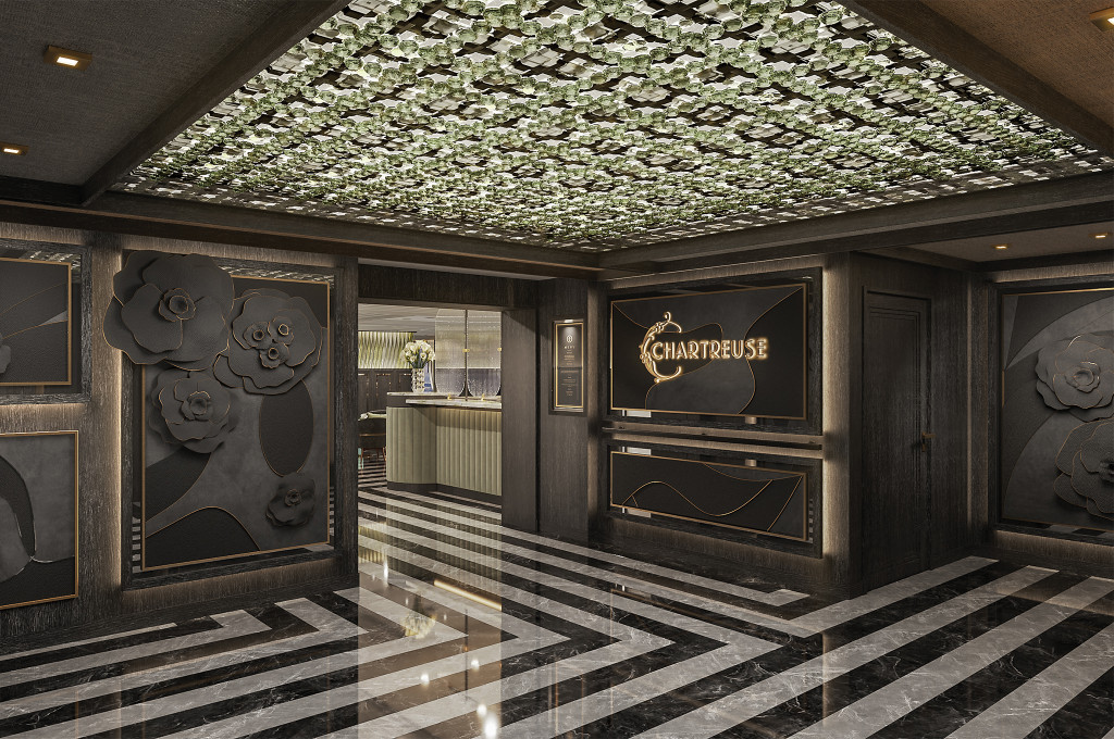 Eindrucksvoller Eingangsbereich des französischen Restaurants Chartreuse mit kunstvollem Blumendecor und Marmorboden an Bord der Seven Seas Grandeur.