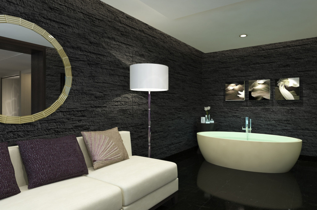 Lotus Spa mit freistehender Badewanne, schwarzer Natursteinwand und modernem Design auf der Majestic Princess.